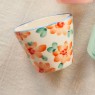 Tazzina da espresso in ceramica con fiori arancioni dipinti a