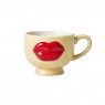 Mug in ceramica crema con labbra in rilievo