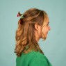 Fermaglio per capelli a forma di bassotto natalizio